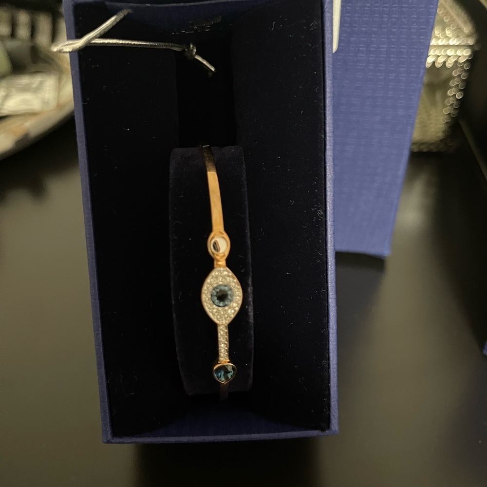 Swarovski Symbolic bangle
Evil eye, Blue, Mixed metal finish
